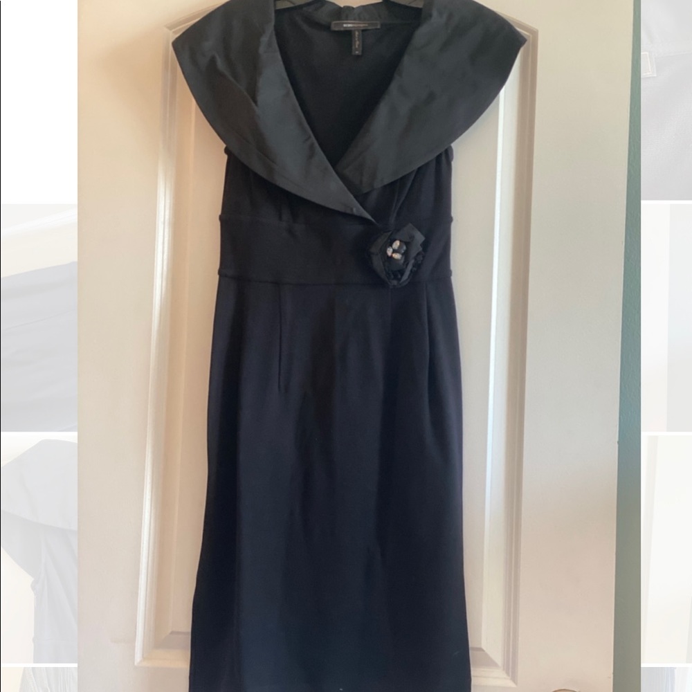 Bcbc Max Azaria Black cocktail dress, beautiful open collar and flower accent.